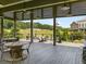 Beautiful outdoor patio featuring wood flooring, a high ceiling, ceiling fans, and outdoor seating at 752 Winton Way, Atlanta, GA 30312