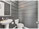 Modern powder room featuring gray walls, pedestal sink, and minimalist decor at 752 Winton Way, Atlanta, GA 30312