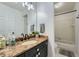Bathroom showcasing a granite countertop, white cabinets, and shower/tub at 3005 Park Chase, Alpharetta, GA 30022