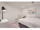 Minimalist bedroom featuring recessed lighting, wood flooring and an abstract painting adds a splash of color at 3005 Park Chase, Alpharetta, GA 30022