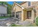 Close up of a stone-clad home with two-car garage and a decorative glass front door at 3005 Park Chase, Alpharetta, GA 30022