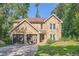 Charming stone-clad home with a two-car garage and well-maintained landscaping at 3005 Park Chase, Alpharetta, GA 30022