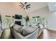 Bright living room featuring a vaulted ceiling, fireplace, and large windows at 3005 Park Chase, Alpharetta, GA 30022