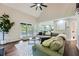 Open concept living room with a vaulted ceiling, backyard access, and view into the kitchen at 3005 Park Chase, Alpharetta, GA 30022