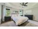 The main bedroom features a tray ceiling, fan, and lots of natural light at 3005 Park Chase, Alpharetta, GA 30022