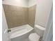 Clean bathroom with tiled shower and bathtub combination, toilet and white walls at 3008 Pine Tree Trl # 16D, Atlanta, GA 30349