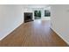 Spacious living room featuring a stone fireplace and sliding glass door at 3008 Pine Tree Trl # 16D, Atlanta, GA 30349