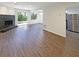 Bright living room with stone fireplace and an adjacent kitchen space at 3008 Pine Tree Trl # 16D, Atlanta, GA 30349