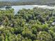 Scenic aerial view of a community nestled amidst dense trees and a sparkling lake, highlighting the natural beauty at 1156 Magnolia Dr, Villa Rica, GA 30180