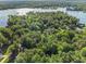 Overhead shot showcasing a peaceful neighborhood bordered by a large lake and mature trees at 1156 Magnolia Dr, Villa Rica, GA 30180