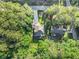 Stunning aerial perspective of home nestled among mature trees, revealing its well-manicured lawn and expansive driveway at 1156 Magnolia Dr, Villa Rica, GA 30180
