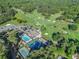 Aerial view showcasing the clubhouse amenities including a pool, tennis courts, and a golf course at 1156 Magnolia Dr, Villa Rica, GA 30180