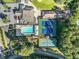 Aerial view showcases tennis courts and a refreshing swimming pool, perfect for active living in a charming community at 1156 Magnolia Dr, Villa Rica, GA 30180