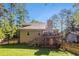 Backyard featuring a deck, well-maintained lawn, and privacy fence at 1156 Magnolia Dr, Villa Rica, GA 30180