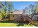 Charming backyard with fenced yard, deck and stairs, perfect for outdoor activities and privacy at 1156 Magnolia Dr, Villa Rica, GA 30180