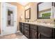 Bathroom featuring double sinks with granite countertops, and tiled floors at 1156 Magnolia Dr, Villa Rica, GA 30180