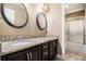Beautiful bathroom with double vanity, granite countertop, framed mirrors, and separate shower room at 1156 Magnolia Dr, Villa Rica, GA 30180