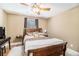 Cozy bedroom with a ceiling fan, a window view, and a white shag rug at 1156 Magnolia Dr, Villa Rica, GA 30180