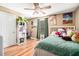 Colorful bedroom with hardwood floors, a ceiling fan, and whimsical decorations at 1156 Magnolia Dr, Villa Rica, GA 30180