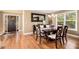 Elegant dining area featuring hardwood floors, a chandelier, and a decorative entrance door at 1156 Magnolia Dr, Villa Rica, GA 30180
