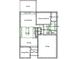 Detailed first-floor plan showcasing a spacious living room, modern kitchen, primary bedroom, and garage layout at 1156 Magnolia Dr, Villa Rica, GA 30180