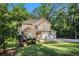 Lovely home with a manicured lawn and mature trees offering shade and privacy in a serene setting at 1156 Magnolia Dr, Villa Rica, GA 30180
