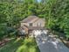 Well-maintained two-story home with a two-car garage and lush green lawn in a wooded community at 1156 Magnolia Dr, Villa Rica, GA 30180