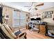 Cozy home office featuring hardwood floors, a ceiling fan, and a window at 1156 Magnolia Dr, Villa Rica, GA 30180