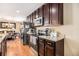 Well-appointed kitchen area featuring granite countertops, stainless steel appliances, and hardwood flooring at 1156 Magnolia Dr, Villa Rica, GA 30180