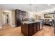 Well-equipped kitchen with an island featuring granite countertops, stainless steel appliances, and hardwood floors at 1156 Magnolia Dr, Villa Rica, GA 30180