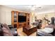 Living room with large entertainment center and hardwood flooring at 1156 Magnolia Dr, Villa Rica, GA 30180