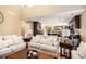 Open-concept living room flowing into the kitchen with hardwood floors and neutral decor at 1156 Magnolia Dr, Villa Rica, GA 30180