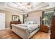 Comfortable main bedroom with hardwood floors, a tray ceiling, and neutral decor at 1156 Magnolia Dr, Villa Rica, GA 30180