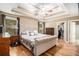Spacious main bedroom featuring hardwood floors, a tray ceiling, and a walk-in closet at 1156 Magnolia Dr, Villa Rica, GA 30180