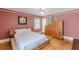 Bedroom with hardwood floors, baseboard trim, wardrobe, and natural light at 2669 Jefferson Terrace Ter, East Point, GA 30344