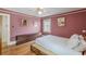 Bedroom with hardwood floors, baseboard trim, dresser, and natural light at 2669 Jefferson Terrace Ter, East Point, GA 30344