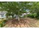 Charming home with pink awnings, surrounded by lush greenery and a tranquil front yard setting at 2669 Jefferson Terrace Ter, East Point, GA 30344
