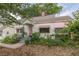 Charming house featuring quaint architectural details, including pink awnings and a lovely garden at 2669 Jefferson Terrace Ter, East Point, GA 30344