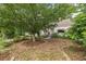 Spacious front yard with mature trees and landscaping, enhancing the curb appeal of this cozy home at 2669 Jefferson Terrace Ter, East Point, GA 30344