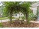 Tranquil outdoor space featuring a stone bench and lush vines, creating a serene escape at 2669 Jefferson Terrace Ter, East Point, GA 30344