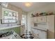 Cozy kitchen featuring checkered floors, ample counter space and updated mint green cabinets at 2669 Jefferson Terrace Ter, East Point, GA 30344