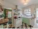 Charming kitchen featuring checkerboard floors, vintage stove, and updated cabinets and appliances at 2669 Jefferson Terrace Ter, East Point, GA 30344