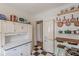 Cozy kitchen with checkered floors, vintage refrigerator, ample shelving, and vintage cabinetry at 2669 Jefferson Terrace Ter, East Point, GA 30344