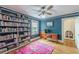 Comfortable office with hardwood floors, blue walls, built-in bookshelves, desk, and decor at 2669 Jefferson Terrace Ter, East Point, GA 30344