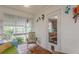 Sunroom features wood-style floors, bright light, and decorative wall hangings at 2669 Jefferson Terrace Ter, East Point, GA 30344