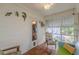 Sunroom with wood-style floors, bright light, and decorative wall hangings at 2669 Jefferson Terrace Ter, East Point, GA 30344