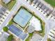 Overhead shot of community featuring tennis courts, a pool, parking, and clubhouse at 2685 Sardis Chase Ct, Buford, GA 30519