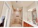 Bathroom with a large tiled glass shower, dual shower heads, bench, and modern sink at 2685 Sardis Chase Ct, Buford, GA 30519