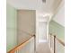 Second floor hallway with carpet, light green walls, and white banister at 2685 Sardis Chase Ct, Buford, GA 30519