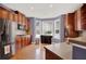Updated kitchen with stainless steel appliances, wood cabinets, and a bay window for natural light at 2685 Sardis Chase Ct, Buford, GA 30519